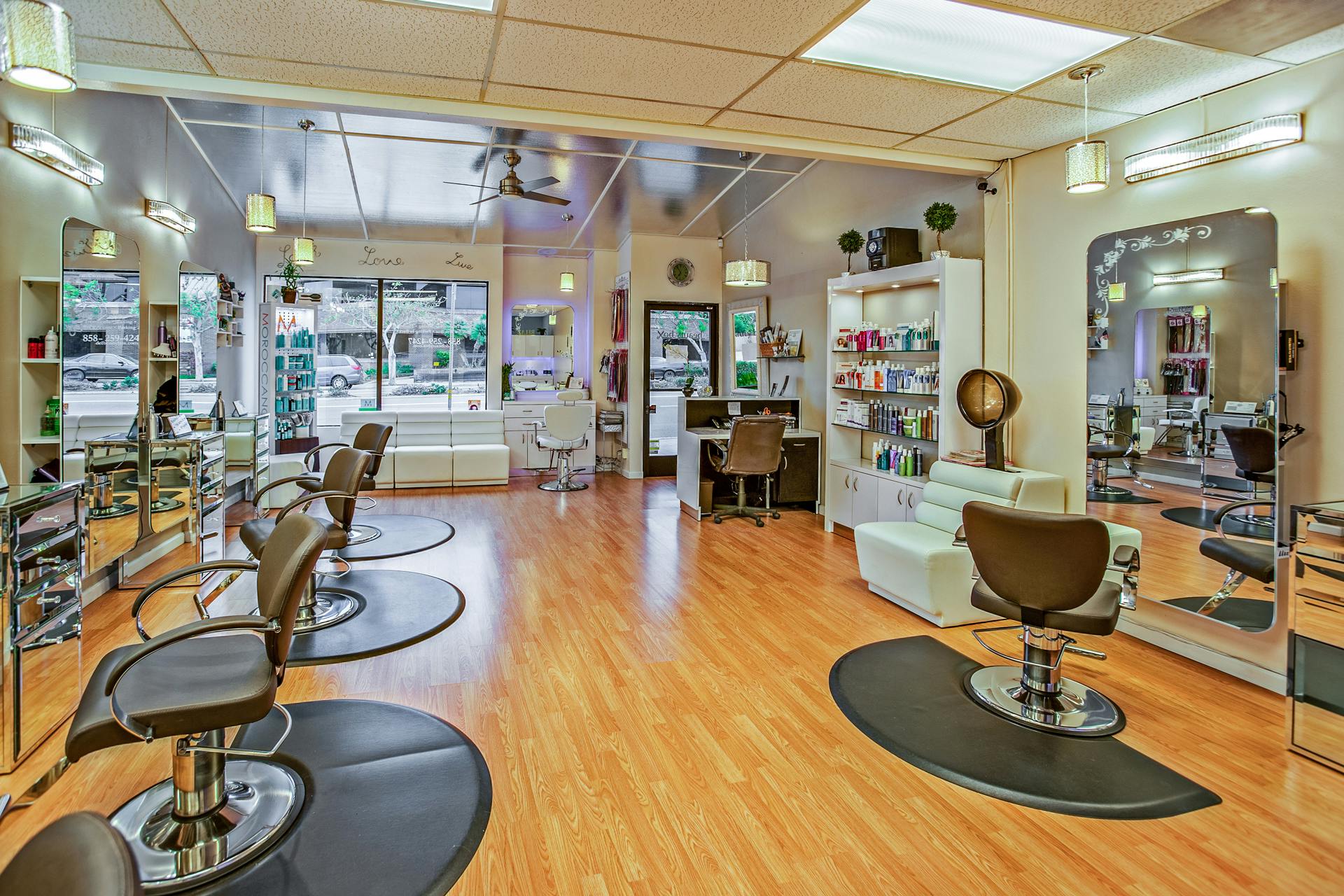 Spacious hair salon in Del Mar, California featuring contemporary design and ample seating.
